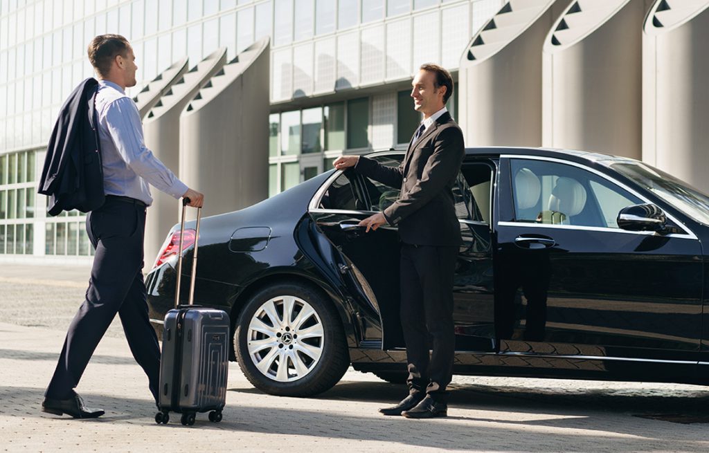 Chauffeur assisting a client at the airport